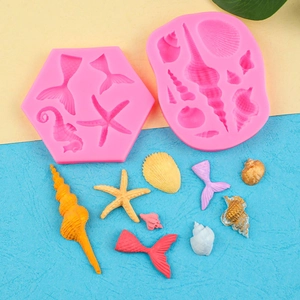 Pink silicone ocean theme molds with seahorse, starfish and shell shapes for cake decor