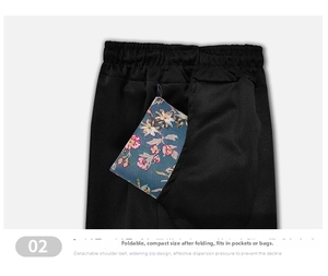 Close-up of a foldable floral shopping bag being tucked into a pocket for easy storage