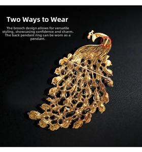 Dual-purpose peacock brooch detail showing rear pin and pendant loop for versatile wear