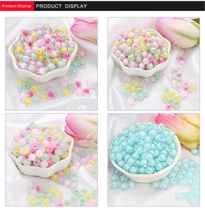 Macro detail of assorted pastel acrylic beads for DIY jewelry and phone chain making