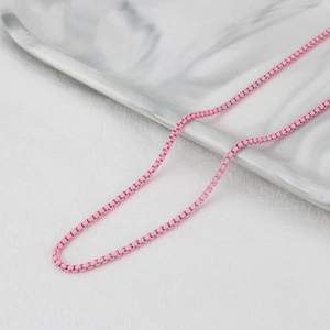 Detail view of macaron pink box chain necklace with smooth matte lacquer finish