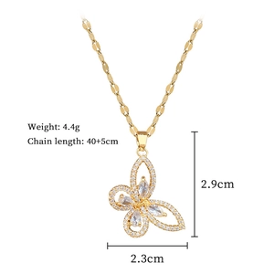 Detailed view of hollow butterfly pendant with zircon inlay and product dimensions