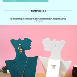 Detail view of golden leaf necklace and earring set on professional display stands