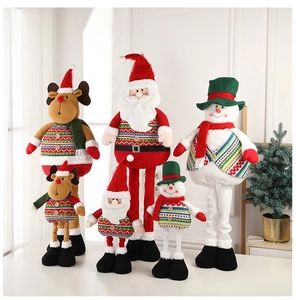 Close-up of plush Santa Claus, reindeer and snowman dolls with knitted textures