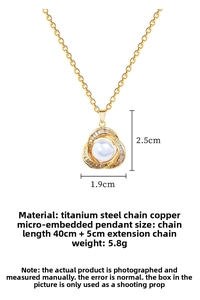 Detailed view of hollow nest pendant with faux pearls and micro-set crystals on titanium chain