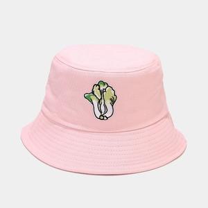 Close-up of pink bucket hat featuring green cabbage embroidery and stitched brim detail