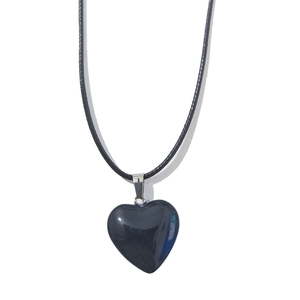 Macro shot of 20mm heart-shaped black stone pendant with polished finish and silver bail