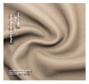 Close-up of premium litchi grain cowhide leather material in a light beige color
