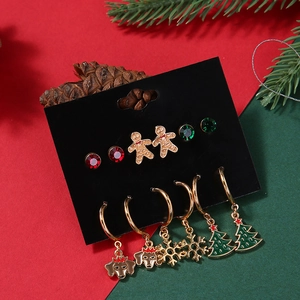 6-pair set of Christmas earrings featuring snowman, snowflake, and tree charms on a gold hoop