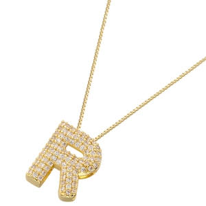 Macro view of gold plated necklace featuring a capital letter R pendant with white zircons