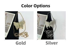 Detail of silver and gold butterfly shaped clutch bags with glittering rhinestones