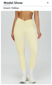 Detailed view of high waisted yoga pants with V-shaped crossover waist in cream yellow