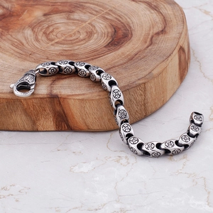 Vintage stainless steel punk bracelet featuring hollow flower patterns and lobster clasp