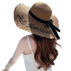 Brown wide brim straw sun hat for women featuring Hello Sunshine embroidery and ribbon