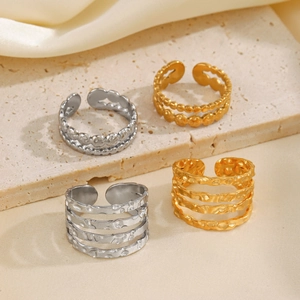 Adjustable stainless steel rings with gold and silver hammered and beaded textures