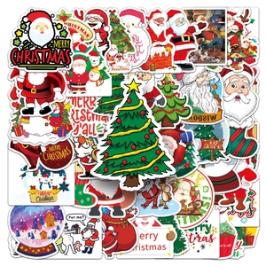 Close-up of assorted festive Christmas stickers featuring Santa, snowmen, and reindeer designs