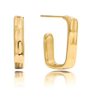 Detail of gold rectangular earrings with irregular hammered texture and metallic luster