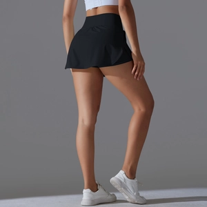 Detail of high-waisted black tennis skort with slimming silhouette and breathable fabric