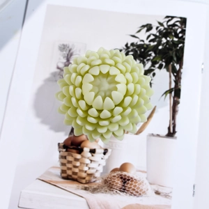Detailed view of light green lotus succulent candle with intricate layered flower petals