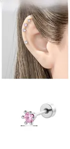 Macro detail of 4mm pink zircon cartilage stud earring with secure screw back design