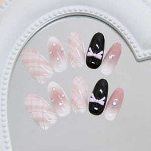 Pink blush press-on nails with plaid patterns, 3D bows, and glitter rhinestones decoration