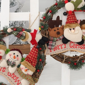Christmas wreath with Santa and Snowman plush on rattan ring for holiday wall decoration