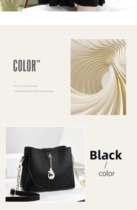 Detail of black bucket bag featuring textured leather and gold chain strap