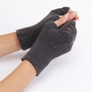 Detailed view of dark grey knitted fingerless gloves with ribbed cuffs on hands