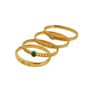Set of four gold-plated titanium steel bracelets with green gems and cubic zirconia