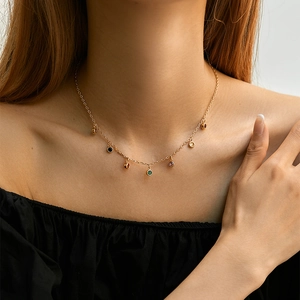 Minimalist gold clavicle chain with multiple colorful round gemstone charms for women