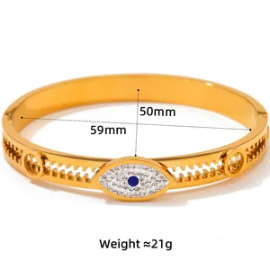 Gold Evil Eye stainless steel open bangle with blue crystal and pave setting diamonds