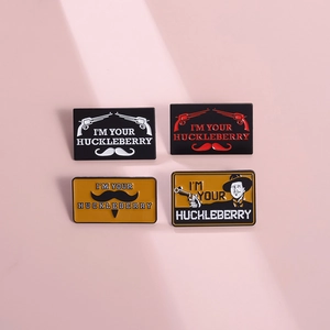 4-piece western cowboy metal pin set featuring I'm Your Huckleberry quote and pistols