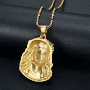 Macro shot of hip hop gold-plated pendant showing detailed matte texture and round pearl chain