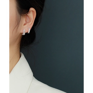 Elegant S925 sterling silver leaf hoop earrings with diamonds worn by a model