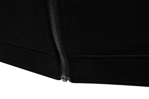 Detail shot of black faux suede jacket hem and premium smooth metallic zipper closure