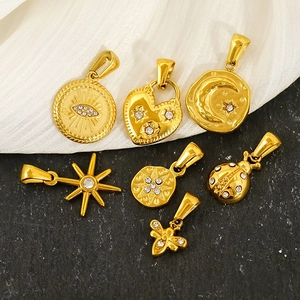 Gold plated star and heart pendant necklaces with white zircon inlays on textured background