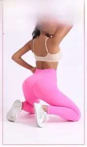Detail view of high-waist seamless yoga pants showing peach butt lifting effect in pink