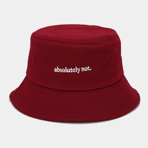 Detail of white 'absolutely not' embroidery on deep red cotton canvas bucket hat