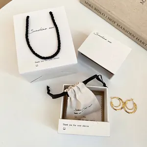 Minimalist double hoop gold earrings set with premium white gift bag and jewelry box