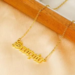 18K gold plated Scorpio zodiac necklace with gothic font pendant on silk background