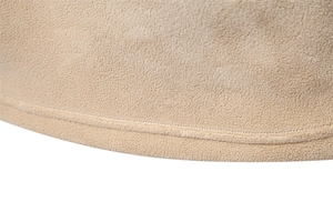 Detailed macro view of the warm beige polar fleece fabric and double-needle stitching hem