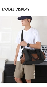 Male model carrying a large black canvas and brown leather travel bag in an indoor setting
