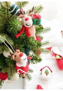 Detailed view of handmade wool felt reindeer ornaments for Christmas tree decoration