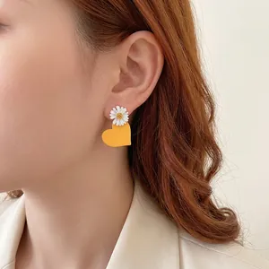 Minimalist daisy heart earrings featuring white flower and orange resin charm for women