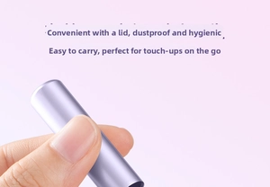 Macro shot of portable purple metal lipstick brush with cap for dustproof makeup storage