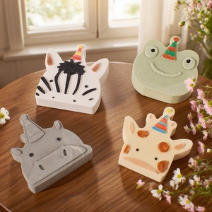 Detail of cute resin animal molds with party hats including zebra and giraffe designs