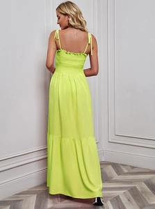 Detail of neon green beach maxi dress with smocked back and adjustable tie straps
