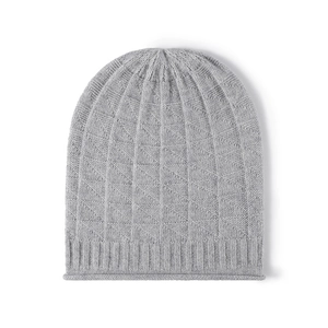 Women's light grey knit beanie with geometric pattern and ribbed cuff on white background
