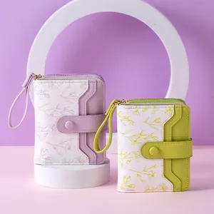Floral print PU leather wallet in lilac and mint green with wristlet and snap closure