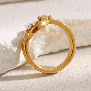 Chic 18K gold plated stainless steel moon ring with sparkling crystal stones on white stone